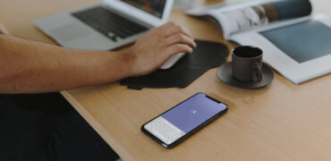 A person working on his laptop and building apps using app development tools