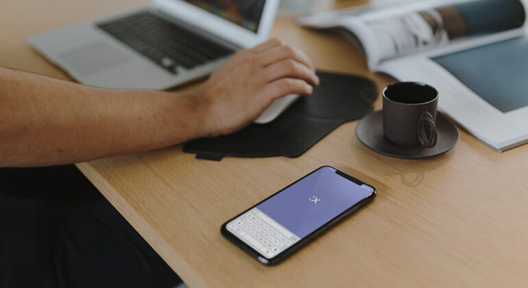 A person working on his laptop and building apps using app development tools