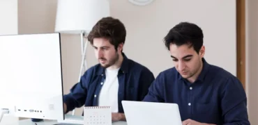 An image where 2 developers are working on cloud app development