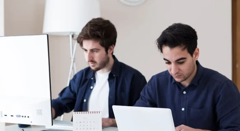 An image where 2 developers are working on cloud app development