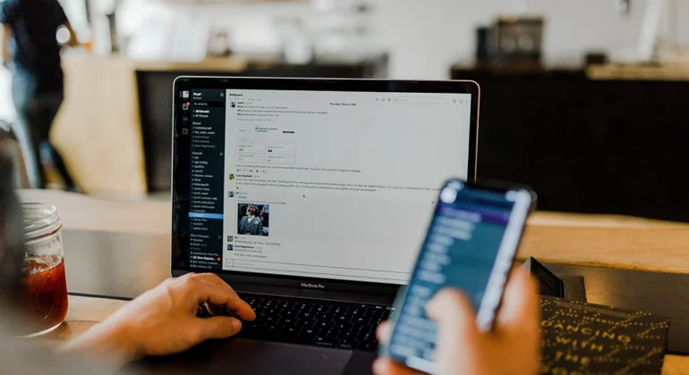 A person with a phone in his hand and developing a mobile app